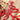 Close up of red gloss powder coat on our Happy Holidays metal wall art.