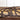 Close up of copper vein powder coat on the oval metal family name sign.