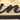 Close up of matte black powder coat on our oblong oval metal family name sign.