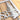 Close up of raw steel on the rectangular metal family name sign.