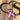 Close up of matte black powder coat with pink vinlyl on the breast cancer ribbon on our survivor metal sign.