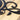Close up of matte black powder coat on our metal monogram sign.
