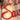 Close up of red gloss powder coat on our Unto Us a Savior is Born metal plaque.
