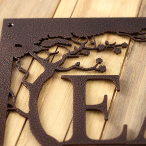Close up of copper vein powder coat on our custom family name sign.