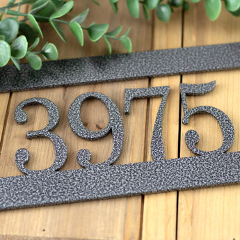 Close up of silver vein powder coat on our hanging metal address sign. 
