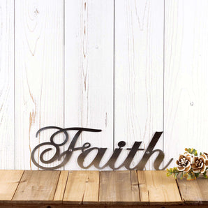 Faith metal plaque with cursive lettering, in raw steel.