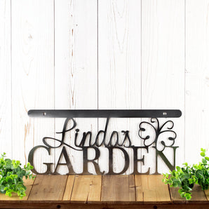 Custom metal garden hanging sign with first name and butterfly, in raw steel. 