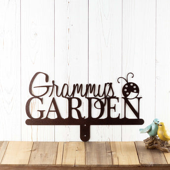 Garden name metal yard sign, with a ladybug silhouette, in copper vein powder coat. 