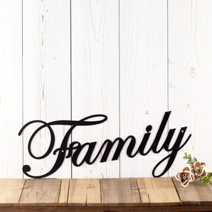 Metal family sign with script writing, in matte black powder coat. 