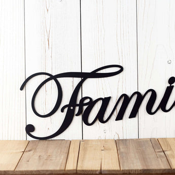 Close up of script lettering on our family metal word art, in matte black powder coat.