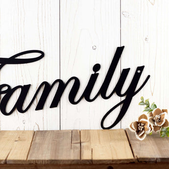 Family metal sign with cursive lettering, in matte black powder coat. 