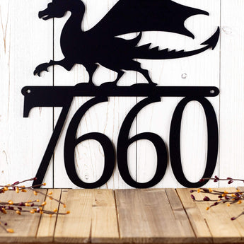 Close up of house number on our dragon metal address sign, in matte black powder coat.