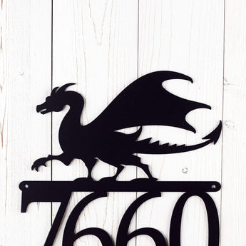 Close up of dragon silhouette on our metal house number sign, in matte black powder coat.
