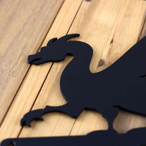 Close up of the matte black powder coat on our 4 digit dragon metal house number sign.