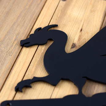 Close up of matte black powder coat on our 4 digit dragon house number sign.