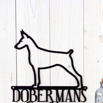 Close up of Doberman silhouette on our Doberman metal wall art, in matte black powder coat. 