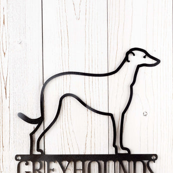 Close up of Greyhound dog silhouette on our Greyhounds Live Here metal sign, in raw steel.
