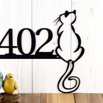 Close up of cat silhouette on our 4 digit metal house number plaque, in matte black powder coat. 