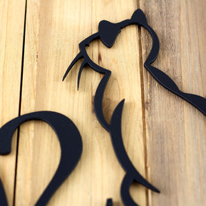 Close up of matte black powder coat on our Cat metal house number sign.