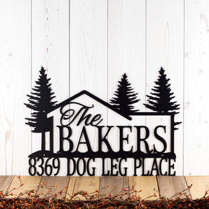 Metal family name and address sign with cabin and pine trees, in matte black powde coat.