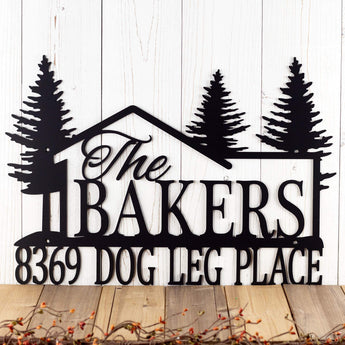 Custom metal family last name and address sign with cabin and pine trees, in matte black powder coat.