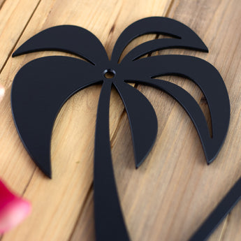 Close up of matte black powder coat on our metal house number sign with palm trees. 