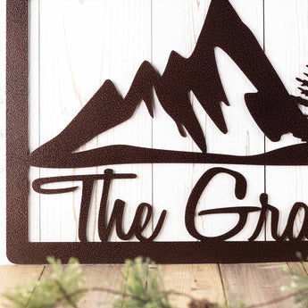 Close up of mountains on our rectangular custom metal name sign.