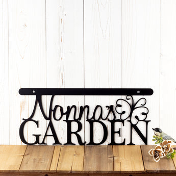 Personalized garden plaque with first name and butterfly, in matte black powder coat.