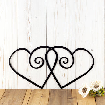 Hearts metal wall art with swirls, in matte black powder coat.