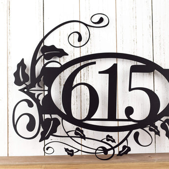Close up of 3 digit metal house number on our metal address plaque, in matte black powder coat. 