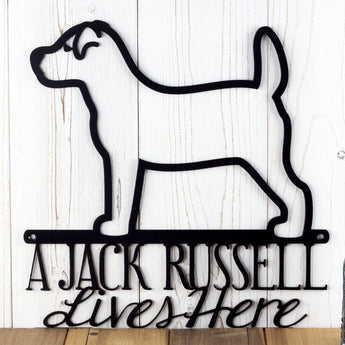 Close up of A Jack Russell Lives Here metal wall art, in matte black powder.