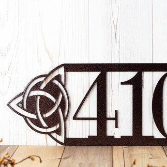 Close up of a 4 digit house number on our metal Celtic knot sign, in copper vein powder coat. 