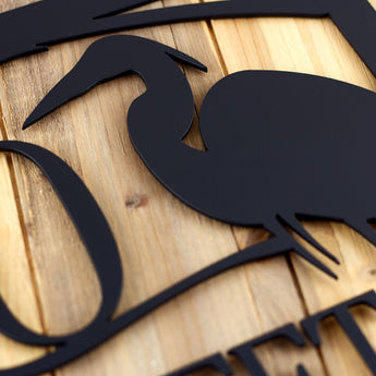 Close up of matte black powder coat on our rectangular metal address plaque.