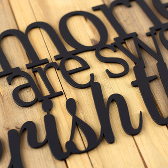 Close up of matte black powder coat on our Memories are sweet cherish them metal plaque.