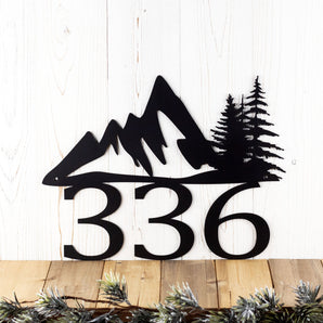 3 digit metal house number sign with mountains and pine trees, in matte black powder coat.