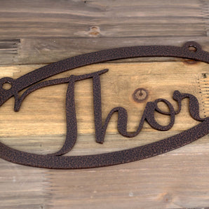 Close up of copper vein powder coat on our oval name metal sign. 