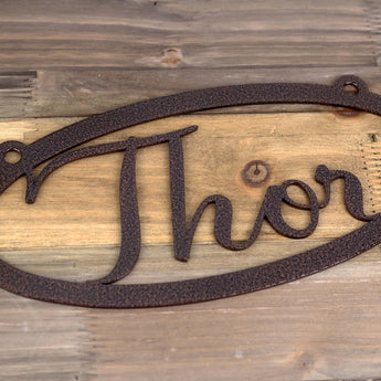 Close up of copper vein powder coat on our oval name metal sign.