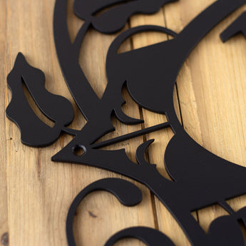 Close up of matte black powder coat on our 4 digit metal house number sign with fleur de lis and vines.