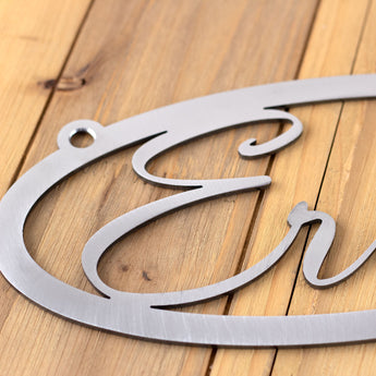 Close up of raw steel on our oval name metal sign. 