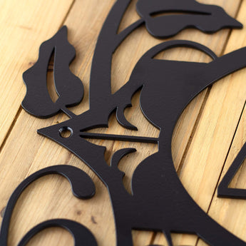 Close up of matte black powder coat on our 3 digit metal house number sign.