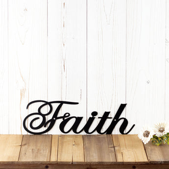 Faith metal wall decor with script lettering, in matte black powder coat.