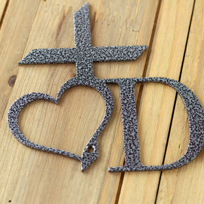 Close up of silver vein powder coat on our custom name sign with cross and heart.