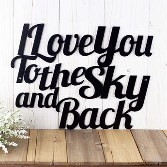 Close up of I Love You To The Sky and Back metal wall art, in matte black powder coat.