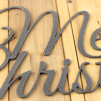 Close up of silver vein powder coat on our Merry Christmas metal sign.