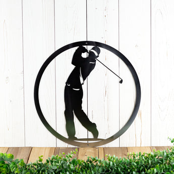 Circular golfer metal wall decor, in raw steel.