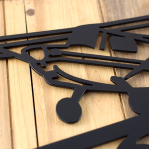 Close up of matte black powder coat on our airplane house number sign.