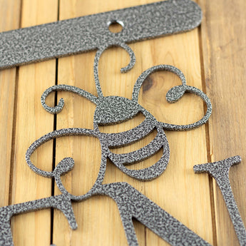 Close up of silver vein powder coat on the garden hanging sign. 