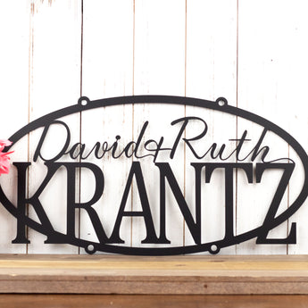 Hanging oval personalized metal sign with first and last names, in matte black powder coat. 