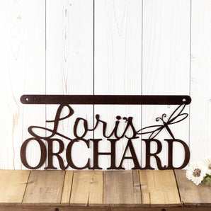 Hanging orchard metal sign with first name and dragonfly, in copper vein powder coat.