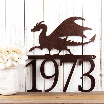4 digit metal house number sign with a dragon silhouette, in copper vein powder coat.